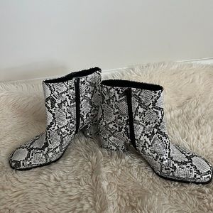 Super cute snake skin heel boots with zipper on the side!Size 10 and worn once!